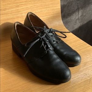 Black leather oxford slips